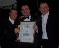 Receiving the Tony Thomas Award from directors of Unit One Entertainment, Steve Sale & Jonny Spangles